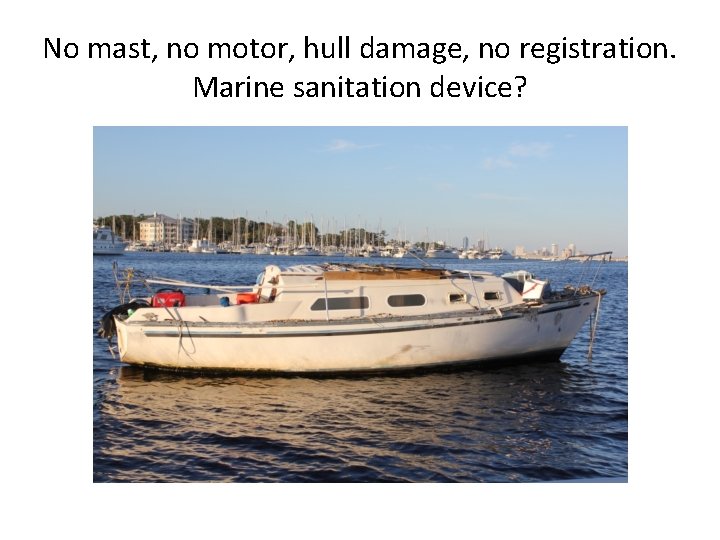 No mast, no motor, hull damage, no registration. Marine sanitation device? 