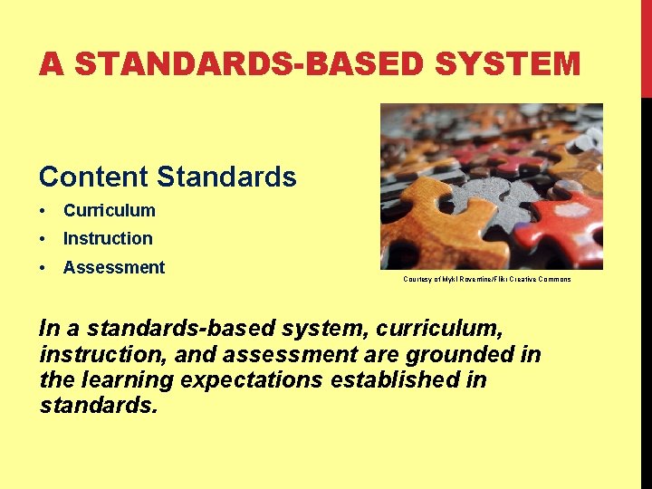 A STANDARDS-BASED SYSTEM Content Standards • Curriculum • Instruction • Assessment Courtesy of Mykl