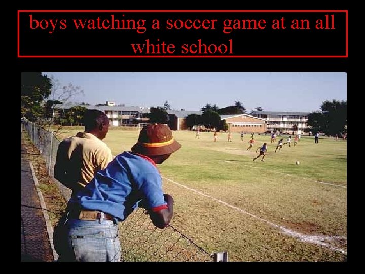 boys watching a soccer game at an all white school 