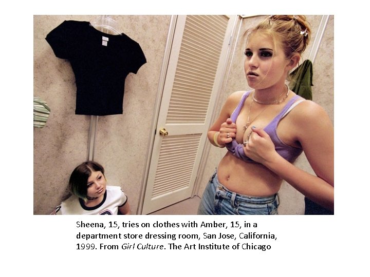Sheena, 15, tries on clothes with Amber, 15, in a department store dressing room,