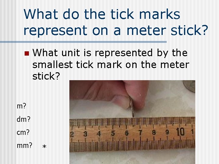 What do the tick marks represent on a meter stick? n What unit is