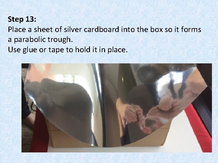 Step 13: Place a sheet of silver cardboard into the box so it forms