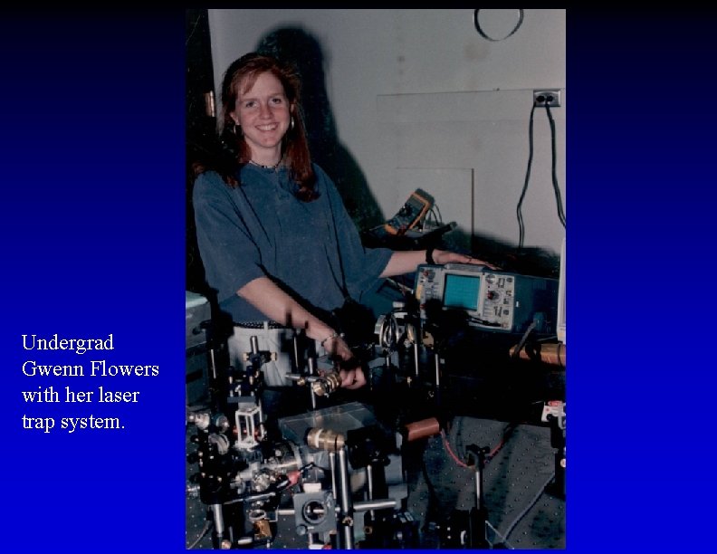 Undergrad Gwenn Flowers with her laser trap system. 