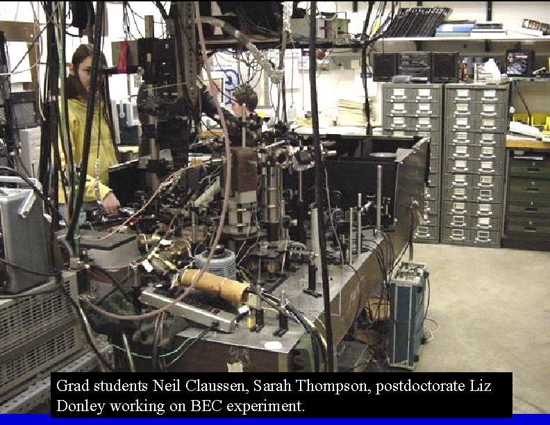 Grad students Neil Claussen, Sarah Thompson, postdoctorate Liz Donley working on BEC experiment. 