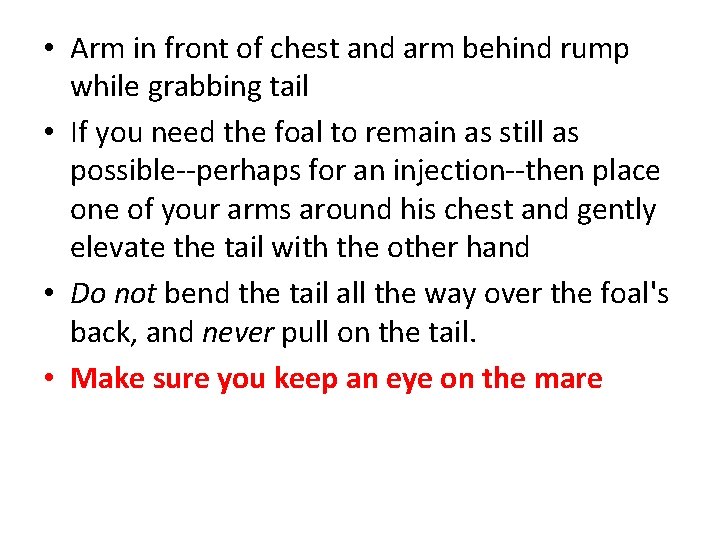  • Arm in front of chest and arm behind rump while grabbing tail
