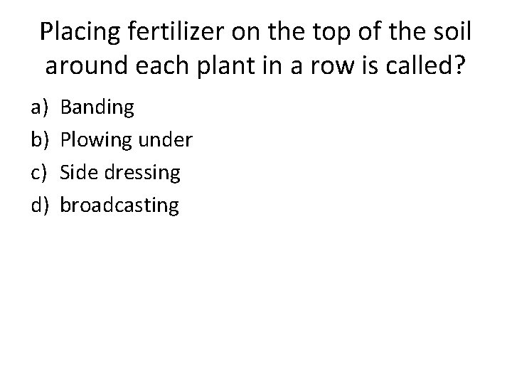 Placing fertilizer on the top of the soil around each plant in a row
