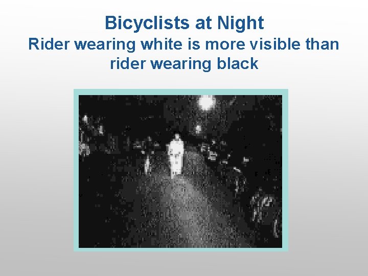 Bicyclists at Night Rider wearing white is more visible than rider wearing black 