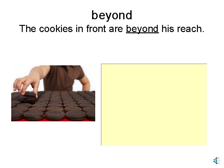 beyond The cookies in front are beyond his reach. 