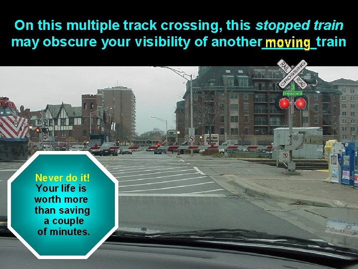 On this multiple track crossing, this stopped train may obscure your visibility of another_______train