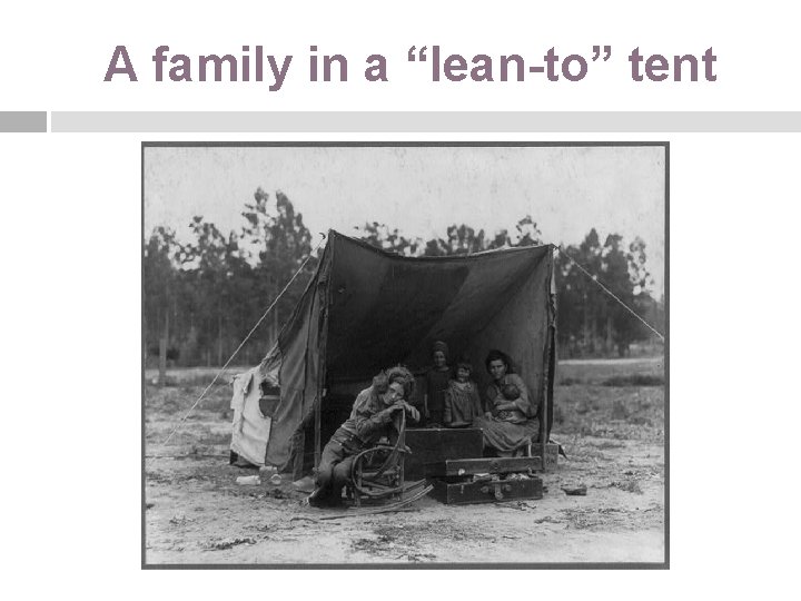 A family in a “lean-to” tent 