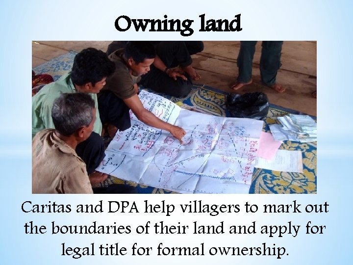 Owning land Caritas and DPA help villagers to mark out the boundaries of their
