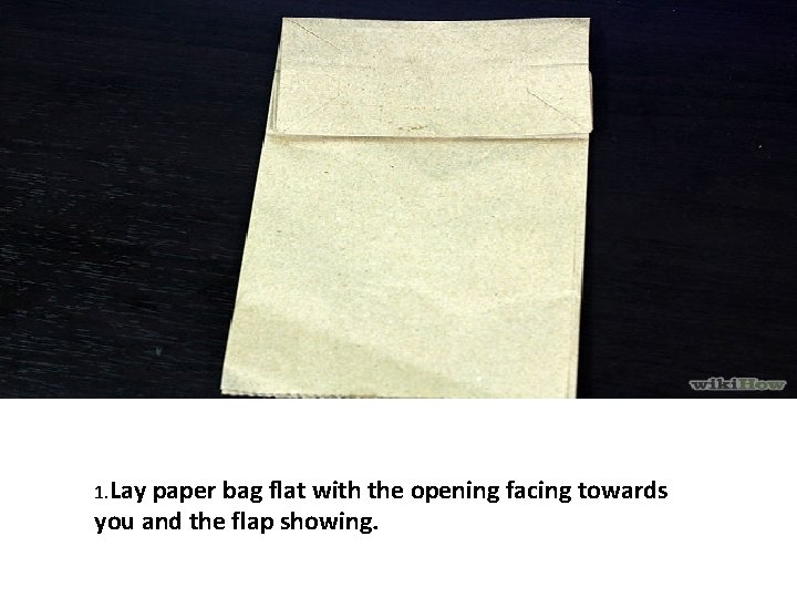 1. Lay paper bag flat with the opening facing towards you and the flap