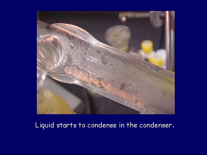 Liquid starts to condense in the condenser. 