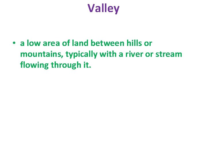 Valley • a low area of land between hills or mountains, typically with a