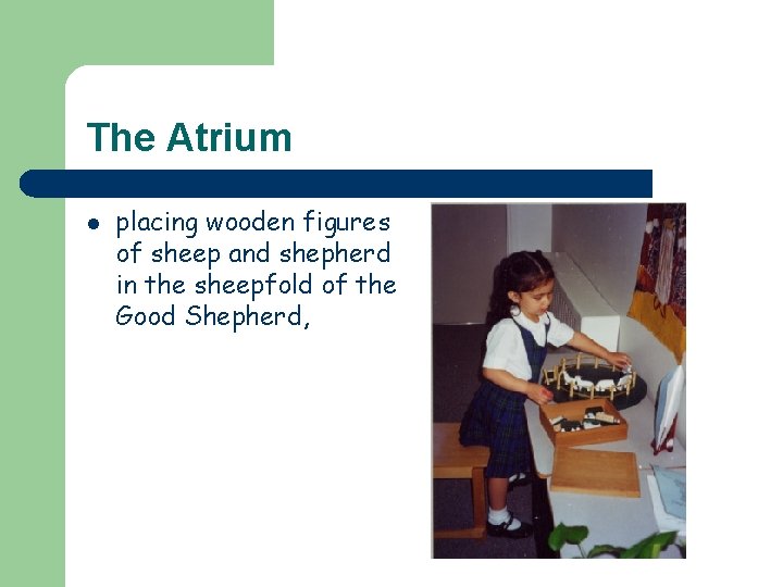 The Atrium l placing wooden figures of sheep and shepherd in the sheepfold of