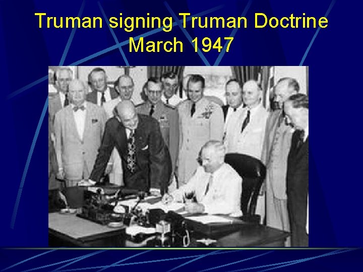 Truman signing Truman Doctrine March 1947 