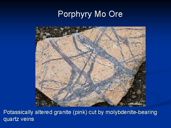 Porphyry Mo Ore Potassically altered granite (pink) cut by molybdenite-bearing quartz veins 