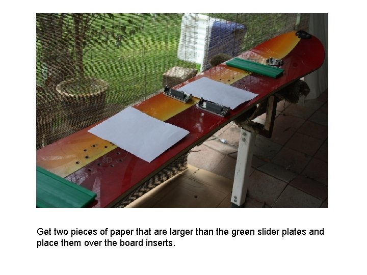 Get two pieces of paper that are larger than the green slider plates and Get two pieces of paper that are larger than the green slider plates and