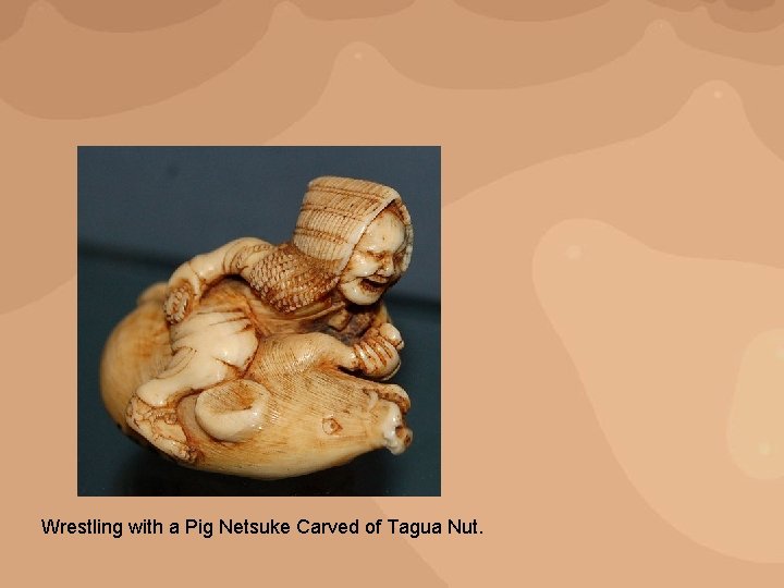 Wrestling with a Pig Netsuke Carved of Tagua Nut. 