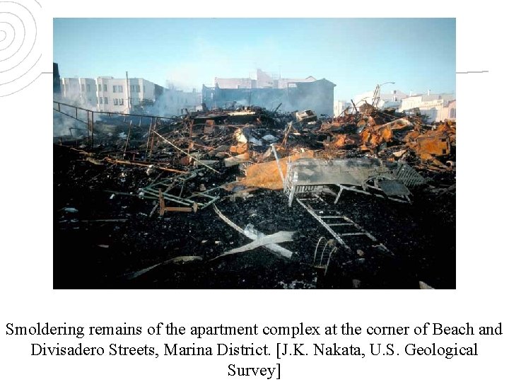 Smoldering remains of the apartment complex at the corner of Beach and Divisadero Streets,