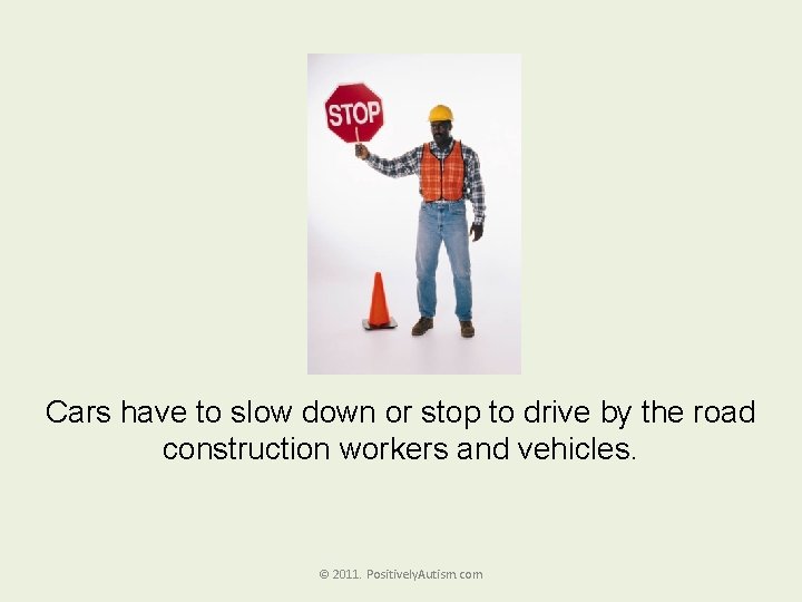 Cars have to slow down or stop to drive by the road construction workers