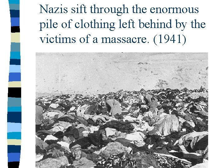 Nazis sift through the enormous pile of clothing left behind by the victims of