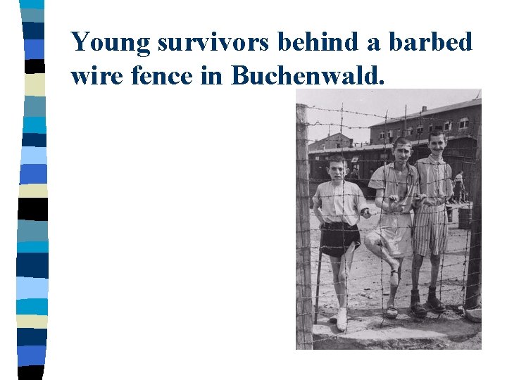 Young survivors behind a barbed wire fence in Buchenwald. 