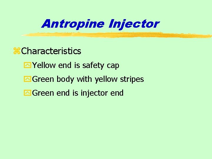 Antropine Injector z. Characteristics y. Yellow end is safety cap y. Green body with