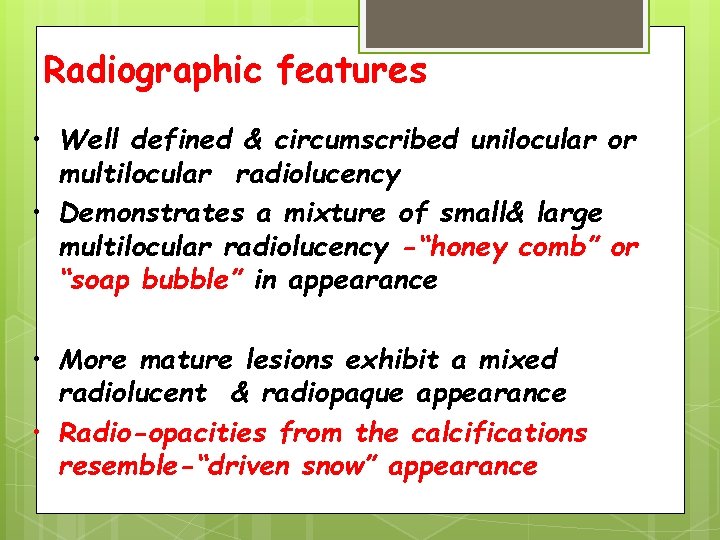 Radiographic features • Well defined & circumscribed unilocular or multilocular radiolucency • Demonstrates a