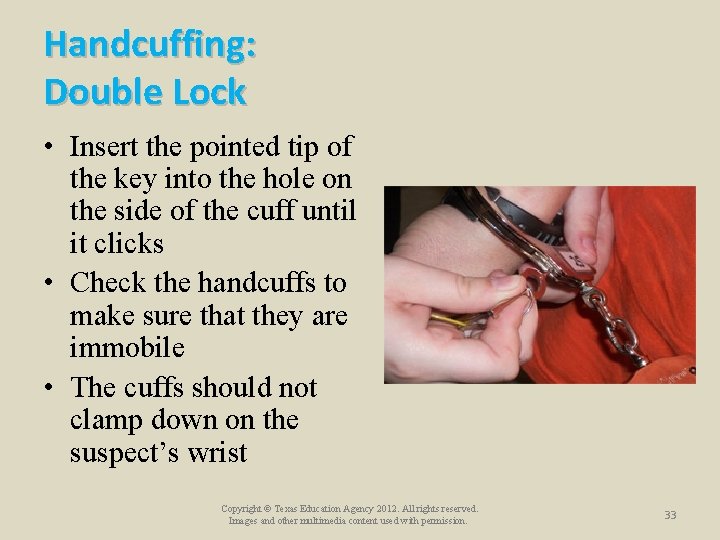Handcuffing: Double Lock • Insert the pointed tip of the key into the hole Handcuffing: Double Lock • Insert the pointed tip of the key into the hole