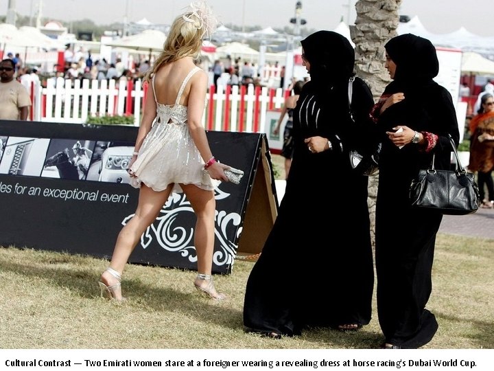 Cultural Contrast — Two Emirati women stare at a foreigner wearing a revealing dress