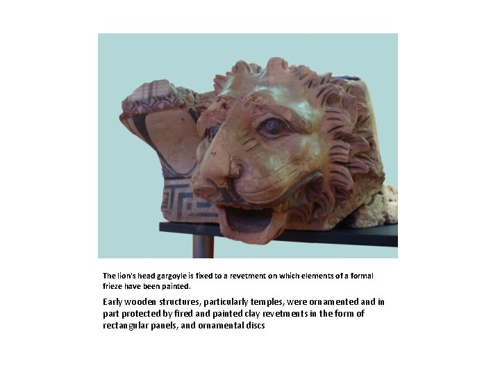 The lion's head gargoyle is fixed to a revetment on which elements of a
