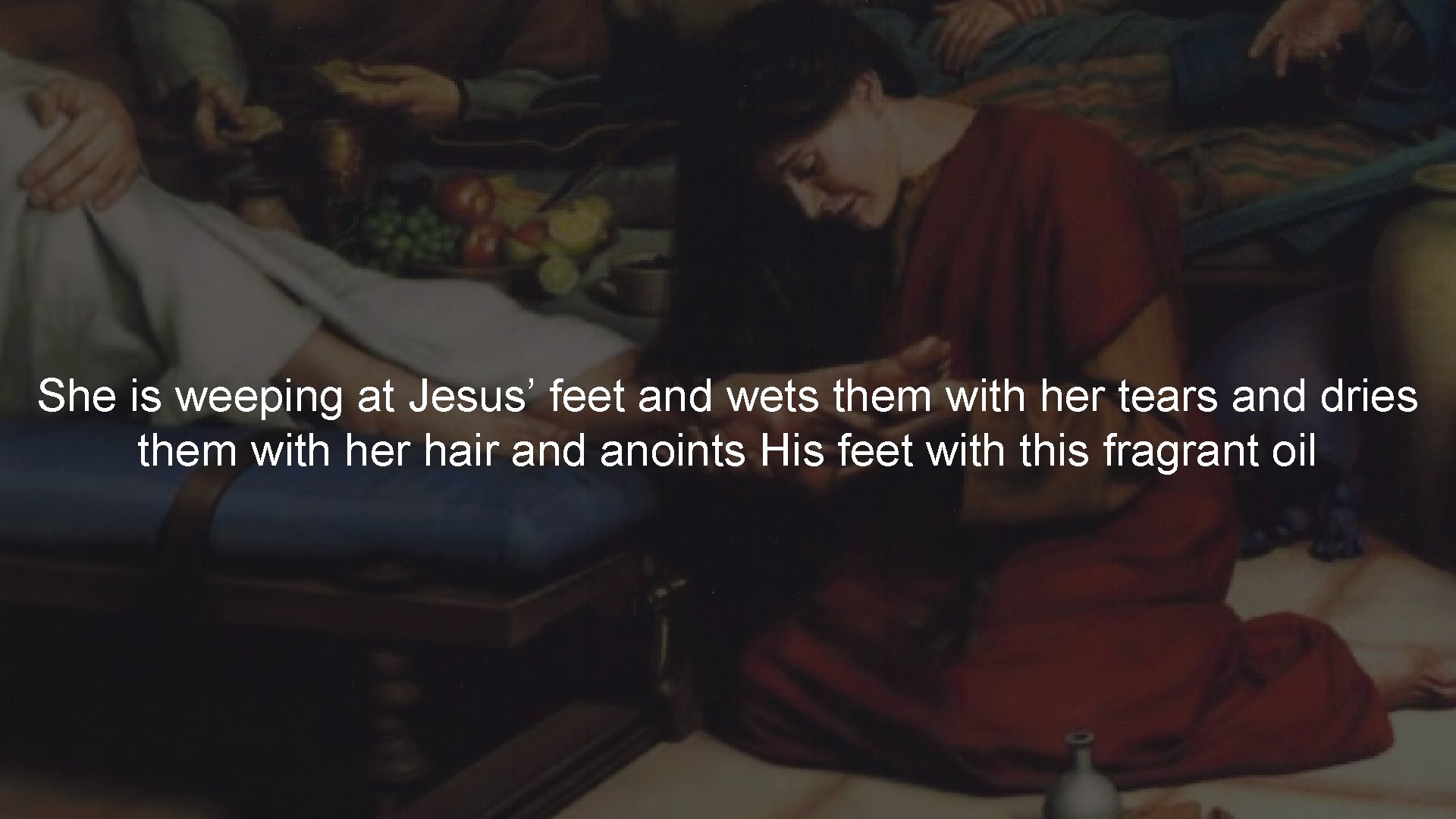 She is weeping at Jesus’ feet and wets them with her tears and dries