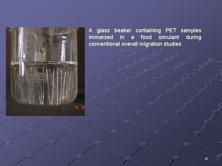 A glass beaker containing PET samples immersed in a food simulant during conventional overall