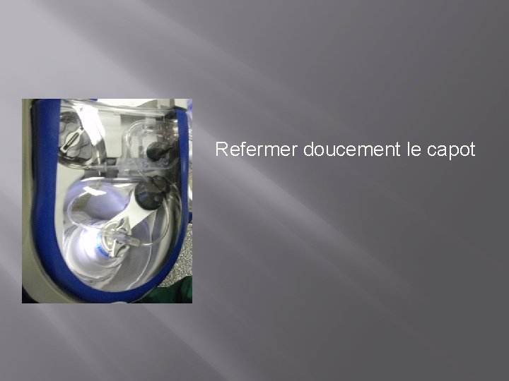 Refermer doucement le capot 