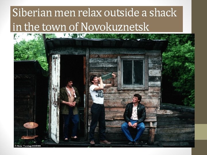 Siberian men relax outside a shack in the town of Novokuznetsk 
