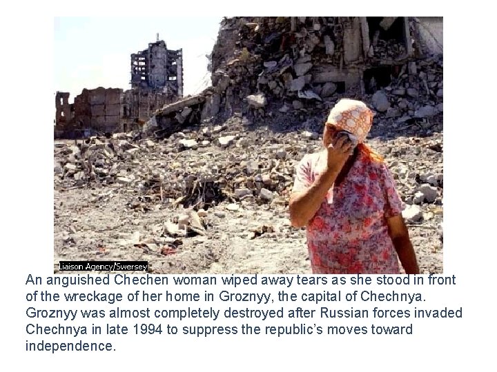 An anguished Chechen woman wiped away tears as she stood in front of the