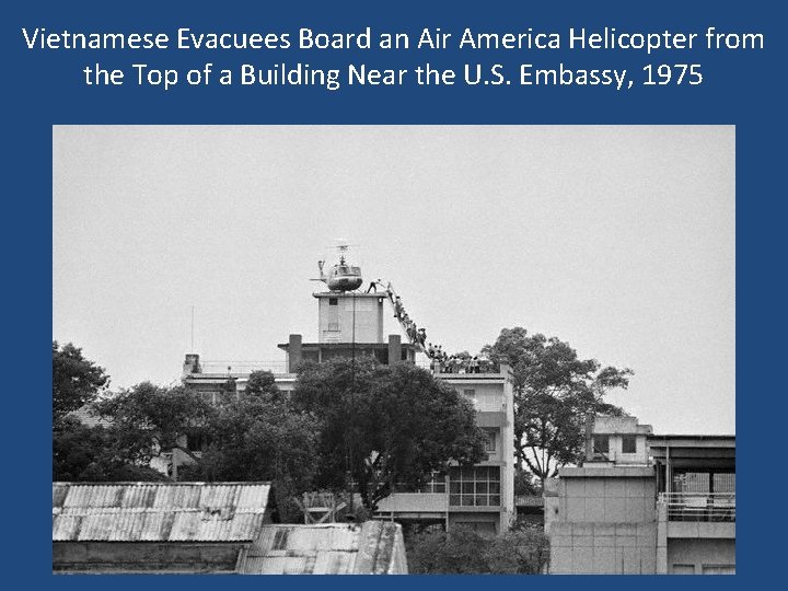 Vietnamese Evacuees Board an Air America Helicopter from the Top of a Building Near