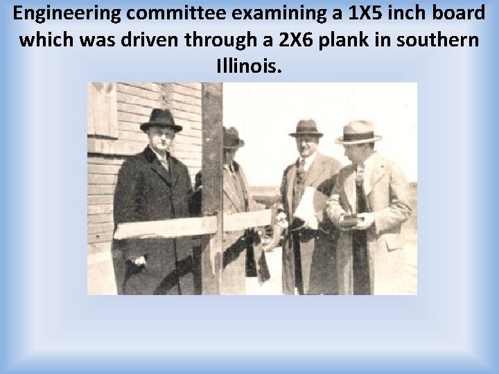 Engineering committee examining a 1 X 5 inch board which was driven through a