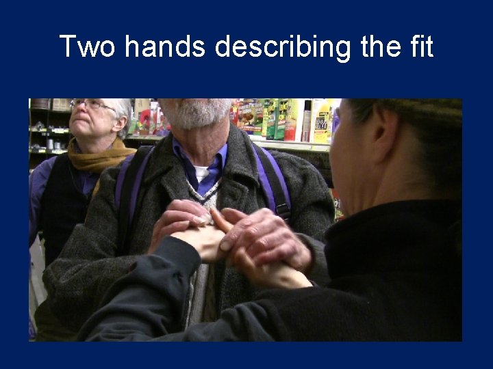 Two hands describing the fit 