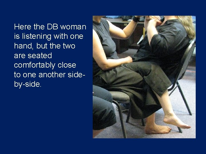 Here the DB woman is listening with one hand, but the two are seated