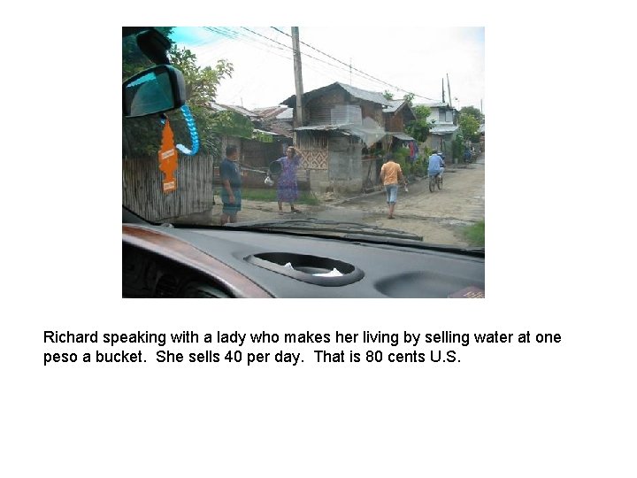 Richard speaking with a lady who makes her living by selling water at one