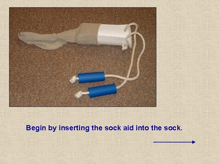 Begin by inserting the sock aid into the sock. Begin by inserting the sock aid into the sock.