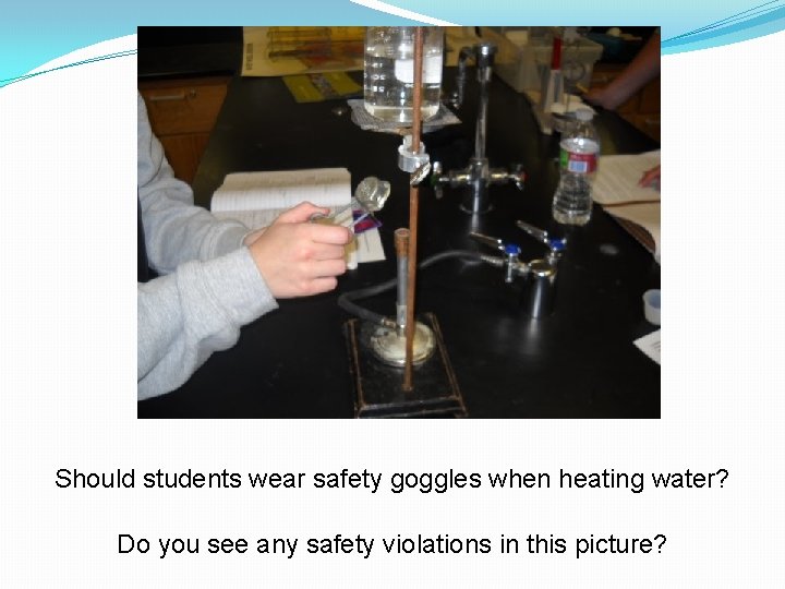 Should students wear safety goggles when heating water? Do you see any safety violations
