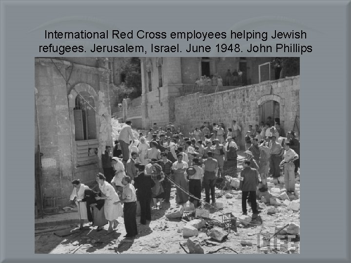 International Red Cross employees helping Jewish refugees. Jerusalem, Israel. June 1948. John Phillips 