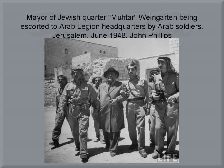 Mayor of Jewish quarter "Muhtar" Weingarten being escorted to Arab Legion headquarters by Arab