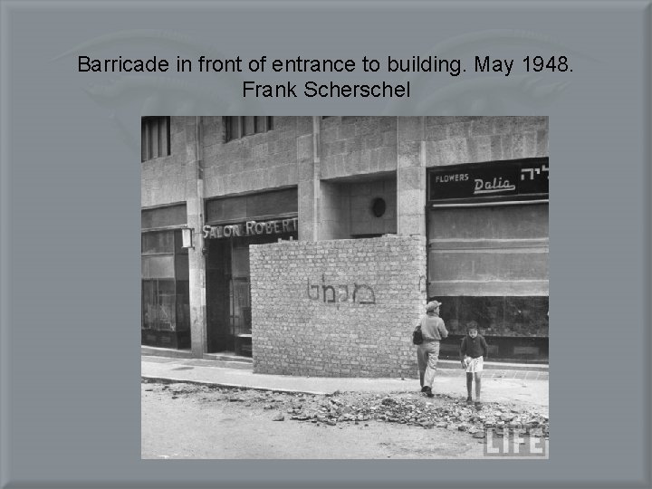 Barricade in front of entrance to building. May 1948. Frank Scherschel 