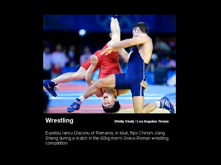 Wrestling (Wally Skalij / Los Angeles Times) Eusebiu Iancu Diaconu of Romania, in blue,