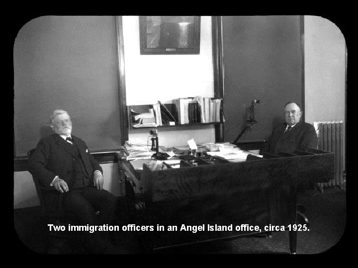 Two immigration officers in an Angel Island office, circa 1925. 