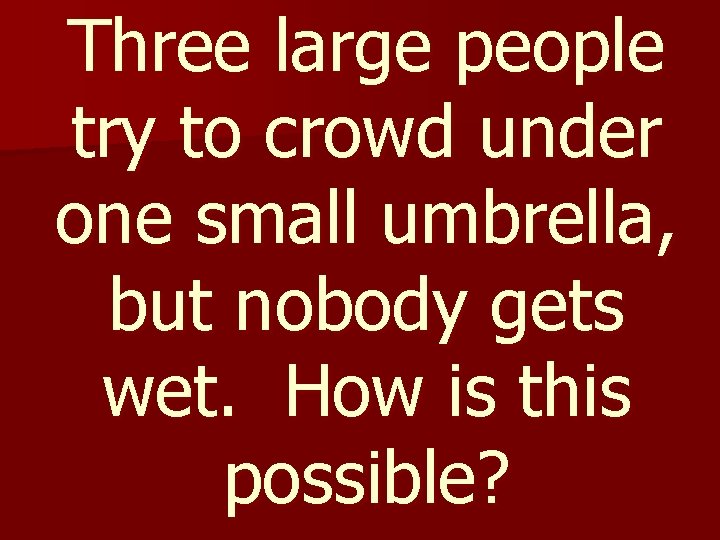 Three large people try to crowd under one small umbrella, but nobody gets wet.